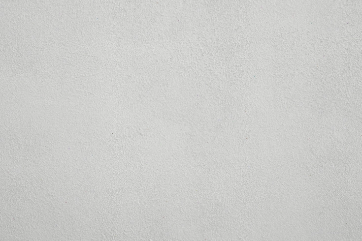 Texture tường vữa xi măng, bề mặt hơi nhám, tạo cảm giác ấm cúng và tự nhiên