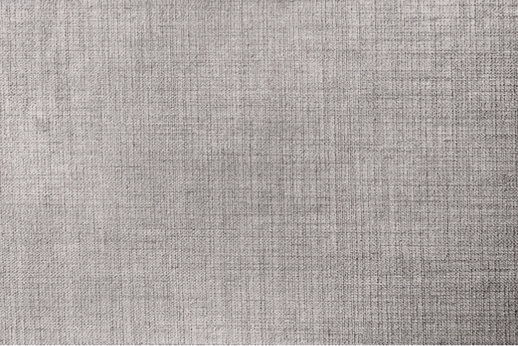 Texture vải dệt màu xám với các sợi vải đan xen dày đặc, thể hiện rõ kỹ thuật dệt
